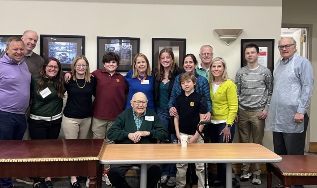 A family smiling and posing for the camera